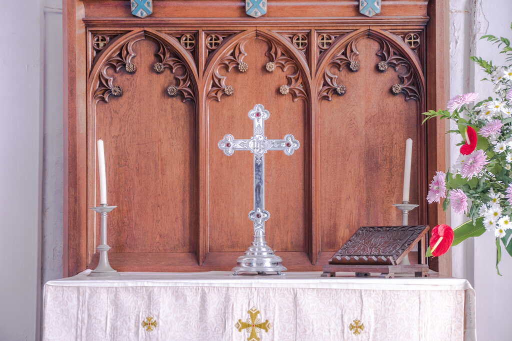 A cross displayed at the altar in a church