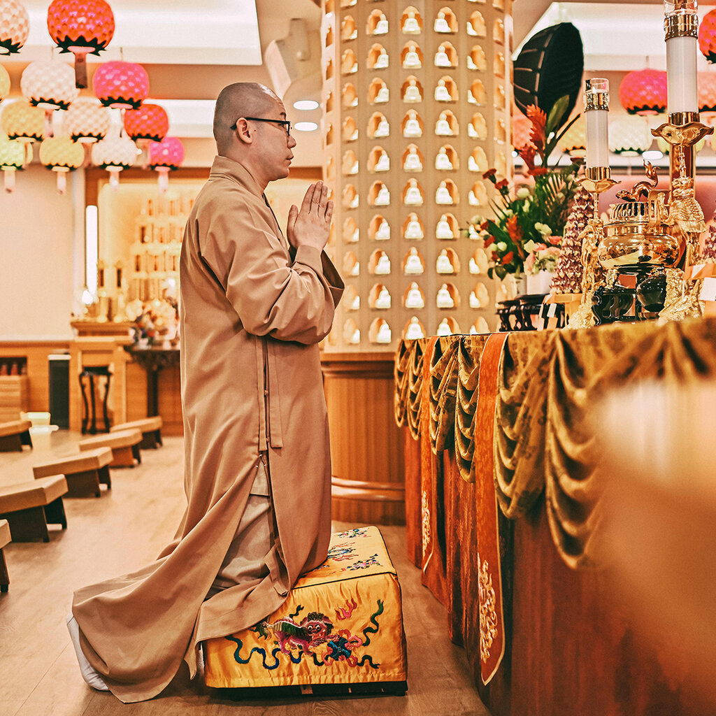 Buddhist monk praying