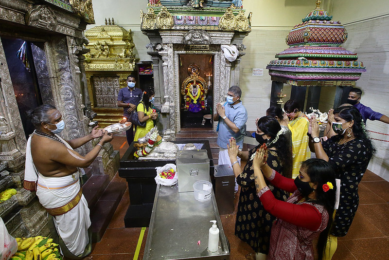 Hindus praying at a temple in Singapore
